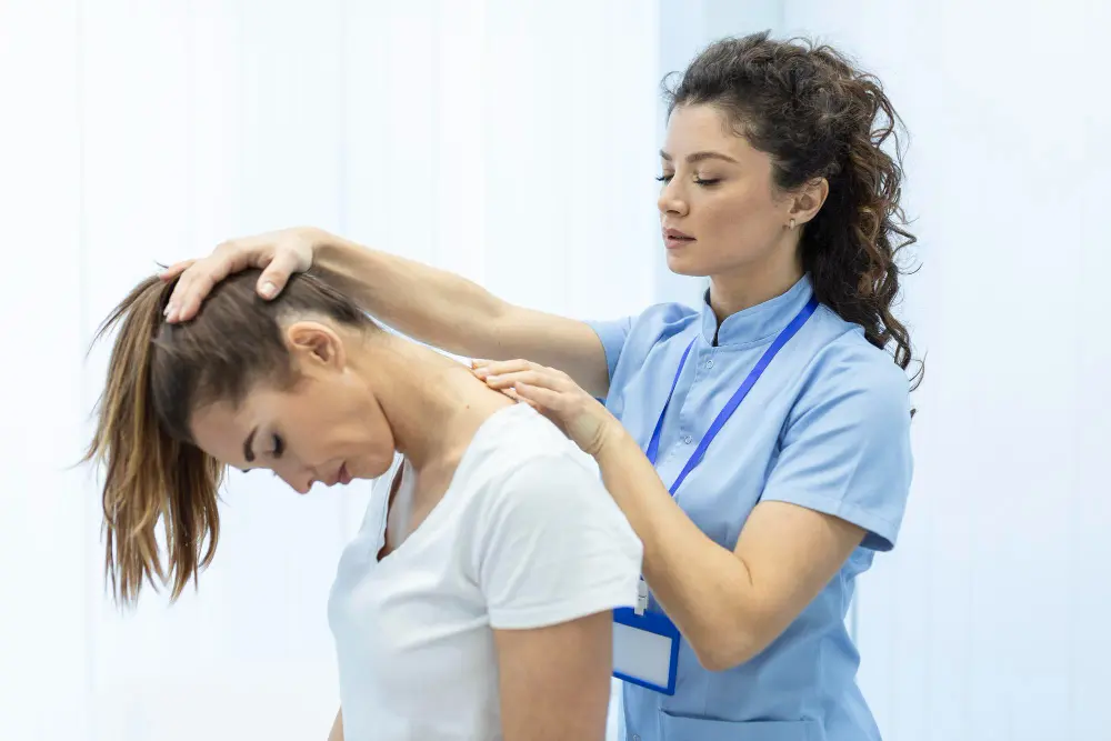 Chiropractor performing neck adjustment therapy