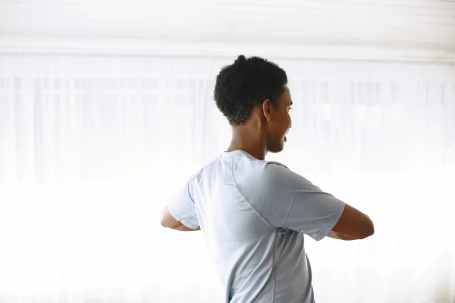 Person stretching and twisting their back to relieve stiffness