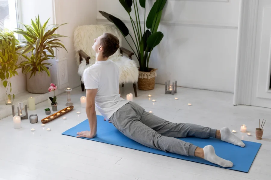 Person stretching lower back during recovery from herniated disc pain