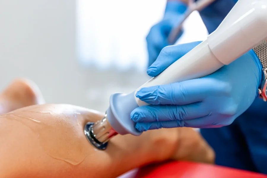 Person receiving laser therapy treatment for foot neuropathy symptoms